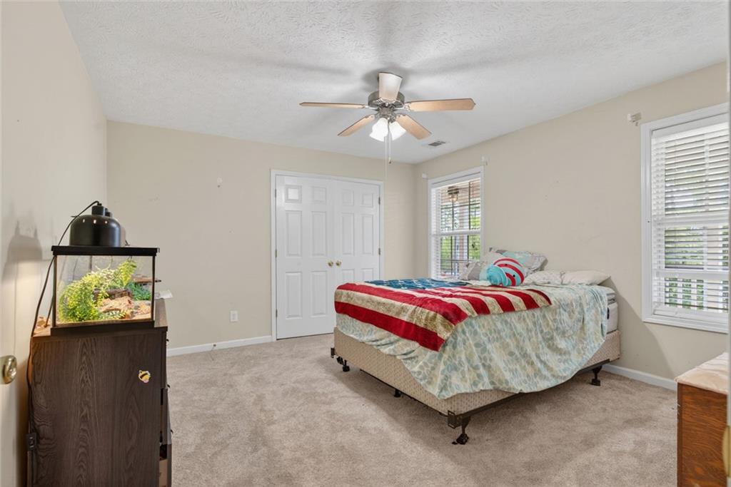120 Norman Road Covington, GA 30014 - Photo 15 of 31 a bed room with a bed and window