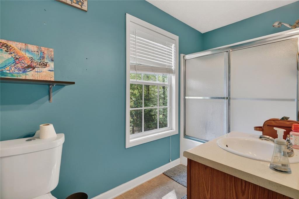 120 Norman Road Covington, GA 30014 - Photo 16 of 31 a bathroom with a sink toilet and window