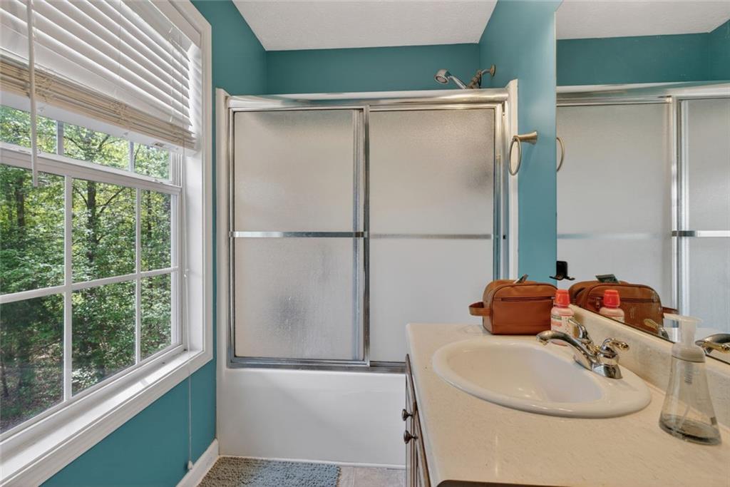 120 Norman Road Covington, GA 30014 - Photo 17 of 31 a bathroom with a sink and a mirror