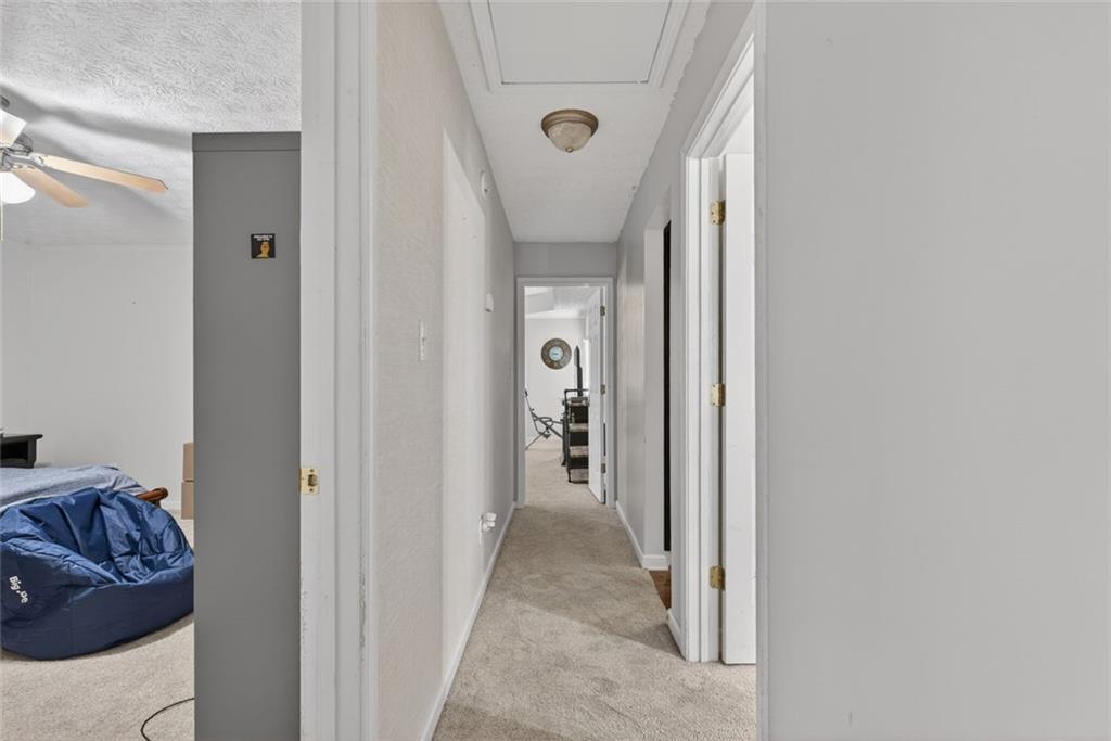 120 Norman Road Covington, GA 30014 - Photo 19 of 31 a view of hallway with furniture and wooden floor