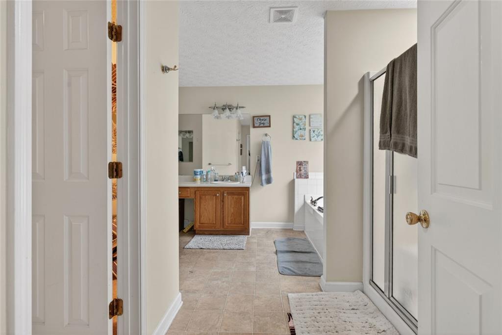 120 Norman Road Covington, GA 30014 - Photo 22 of 31 a bathroom with a tub and shower