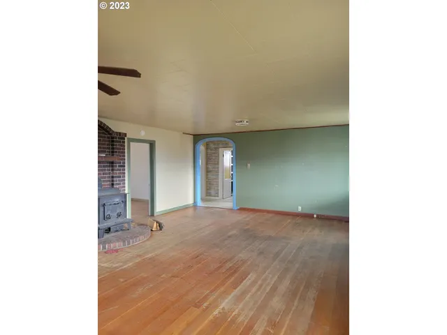 a view of a hallway with a chandelier