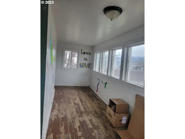 a view of a hallway with seating space