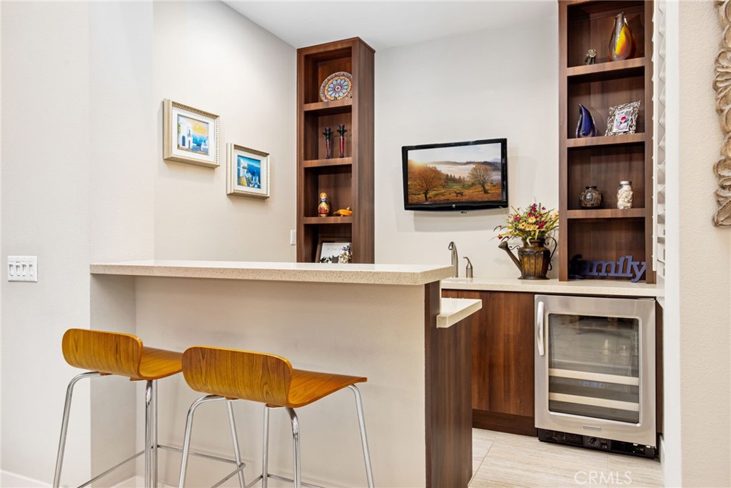 15 Via Montagna Rancho Mirage, CA 92270 - Photo 13 of 75 a living room with flat screen tv and cabinets