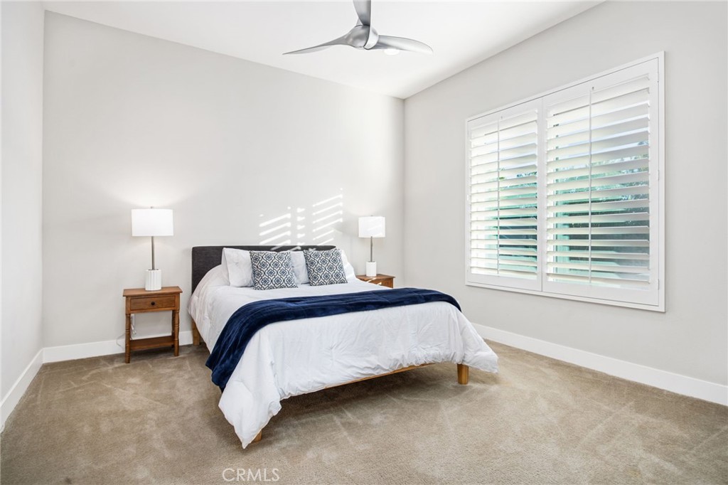 15 Via Montagna Rancho Mirage, CA 92270 - Photo 21 of 75 a bed sitting in a bedroom next to a window