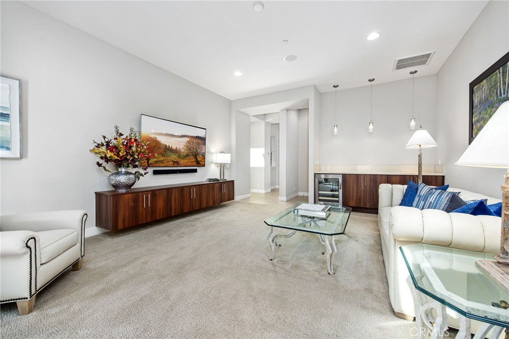15 Via Montagna Rancho Mirage, CA 92270 - Photo 48 of 75 a living room with furniture and a flat screen tv