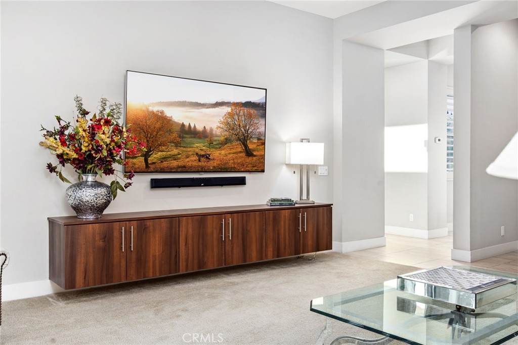 15 Via Montagna Rancho Mirage, CA 92270 - Photo 49 of 75 a living room with furniture and a flat screen tv