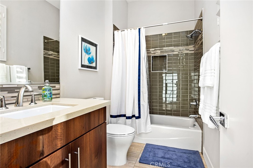 15 Via Montagna Rancho Mirage, CA 92270 - Photo 59 of 75 a bathroom with a granite countertop sink toilet tub and shower