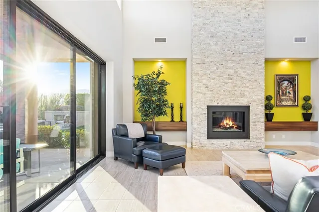 a kitchen with stainless steel appliances kitchen island granite countertop a refrigerator and a stove top oven