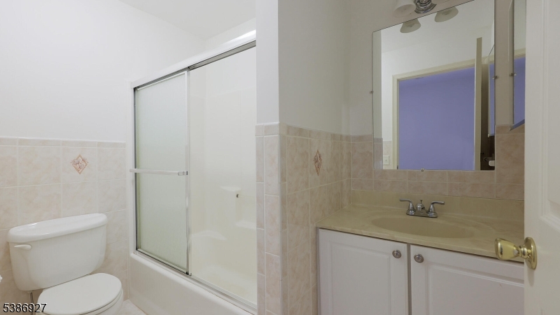 16 Riga Court Scotch Plains, NJ 07076 - Photo 24 of 33 a bathroom with a granite countertop sink toilet and shower