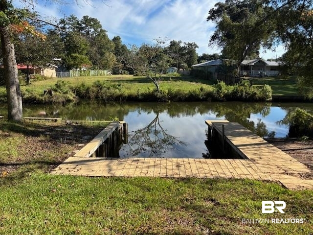 7310 Cook Road Foley, AL 36535 - Photo 6 of 14 Dock with a water view and a lawn