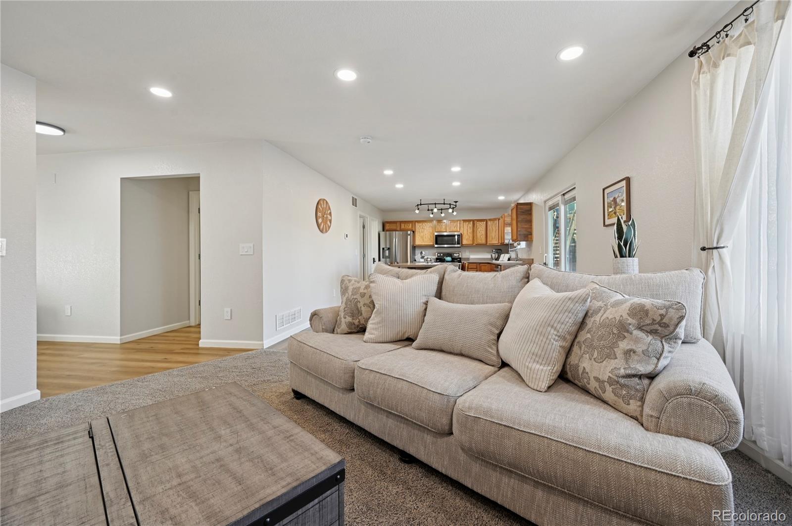 795 Winebrook Way Fountain, CO 80817 - Photo 13 of 41 a living room with furniture and a rug