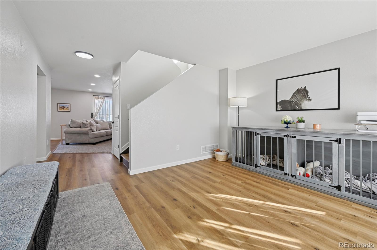 795 Winebrook Way Fountain, CO 80817 - Photo 7 of 41 a view of a bedroom with wooden floor