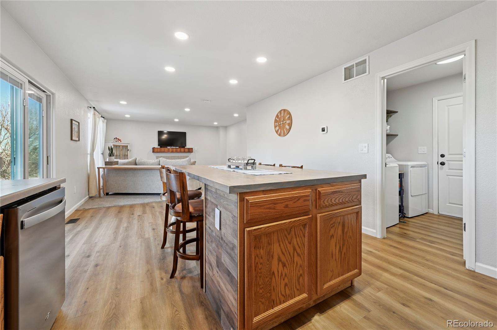 795 Winebrook Way Fountain, CO 80817 - Photo 10 of 41 a kitchen with stainless steel appliances granite countertop a stove and a refrigerator