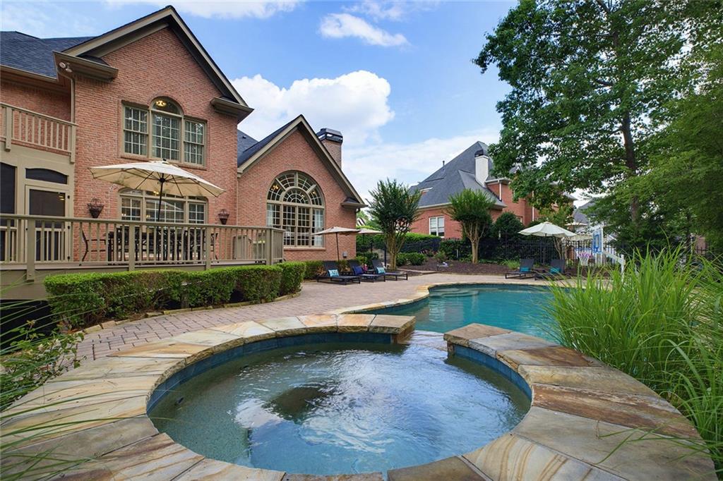 14442 Club Circle Milton, GA 30004 - Photo 65 of 82 a view of a house with swimming pool lawn chairs and a fire pit