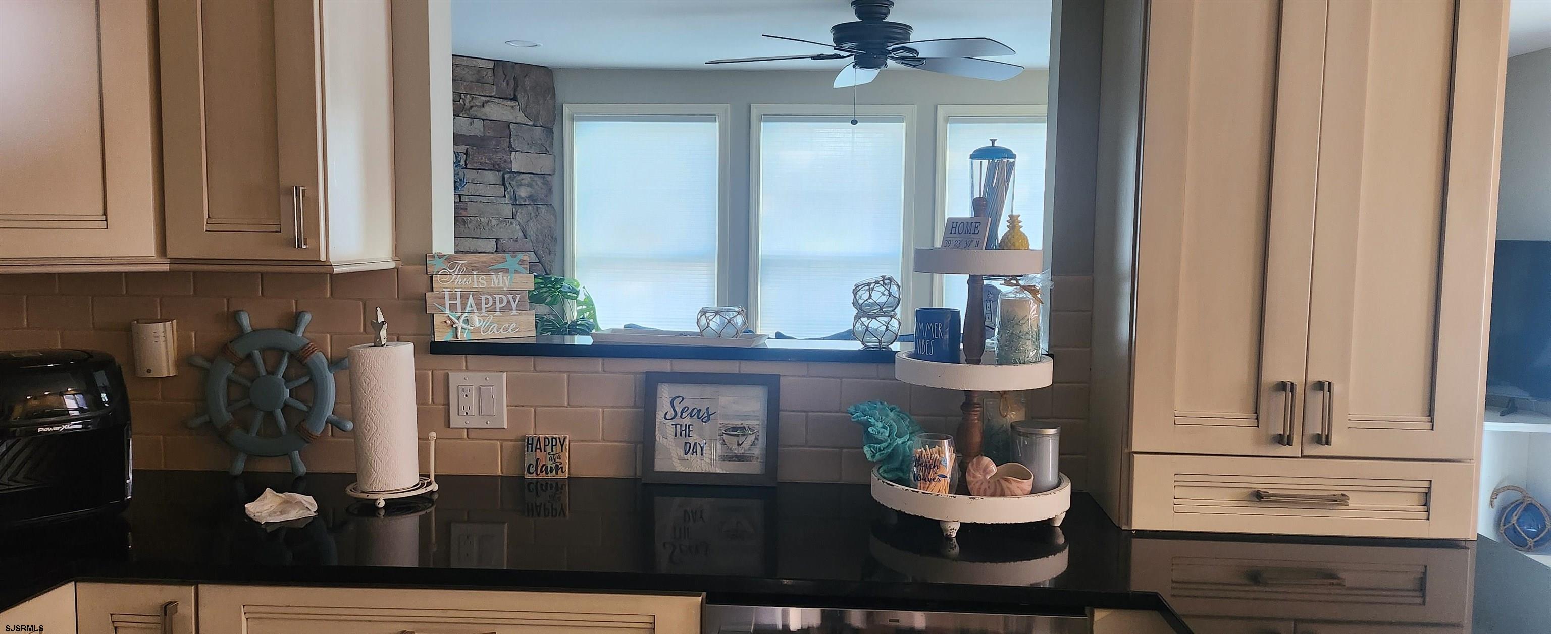 5217 Harbor Beach Boulevard, Unit SEA POINT Brigantine, NJ 08203 - Photo 19 of 38 a living room with furniture and a window