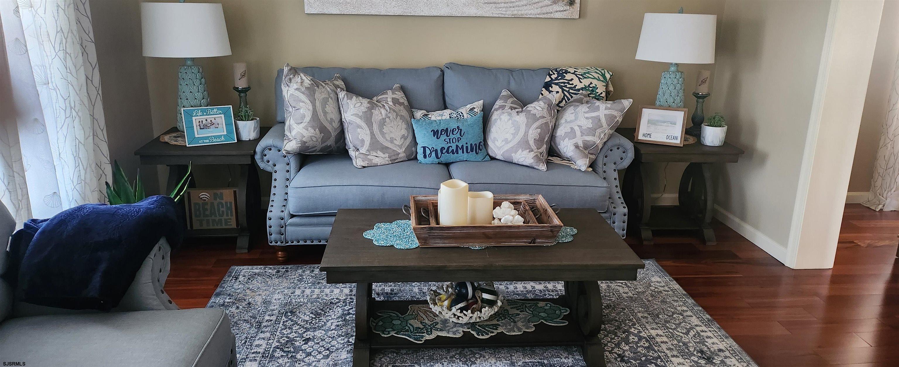 5217 Harbor Beach Boulevard, Unit SEA POINT Brigantine, NJ 08203 - Photo 2 of 38 a living room with furniture and a wooden floor