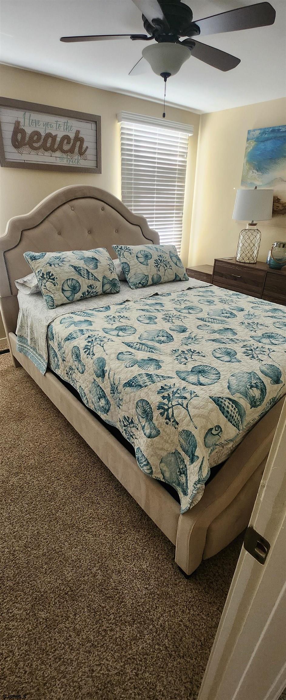 5217 Harbor Beach Boulevard, Unit SEA POINT Brigantine, NJ 08203 - Photo 28 of 38 a bedroom with a bed and a dresser