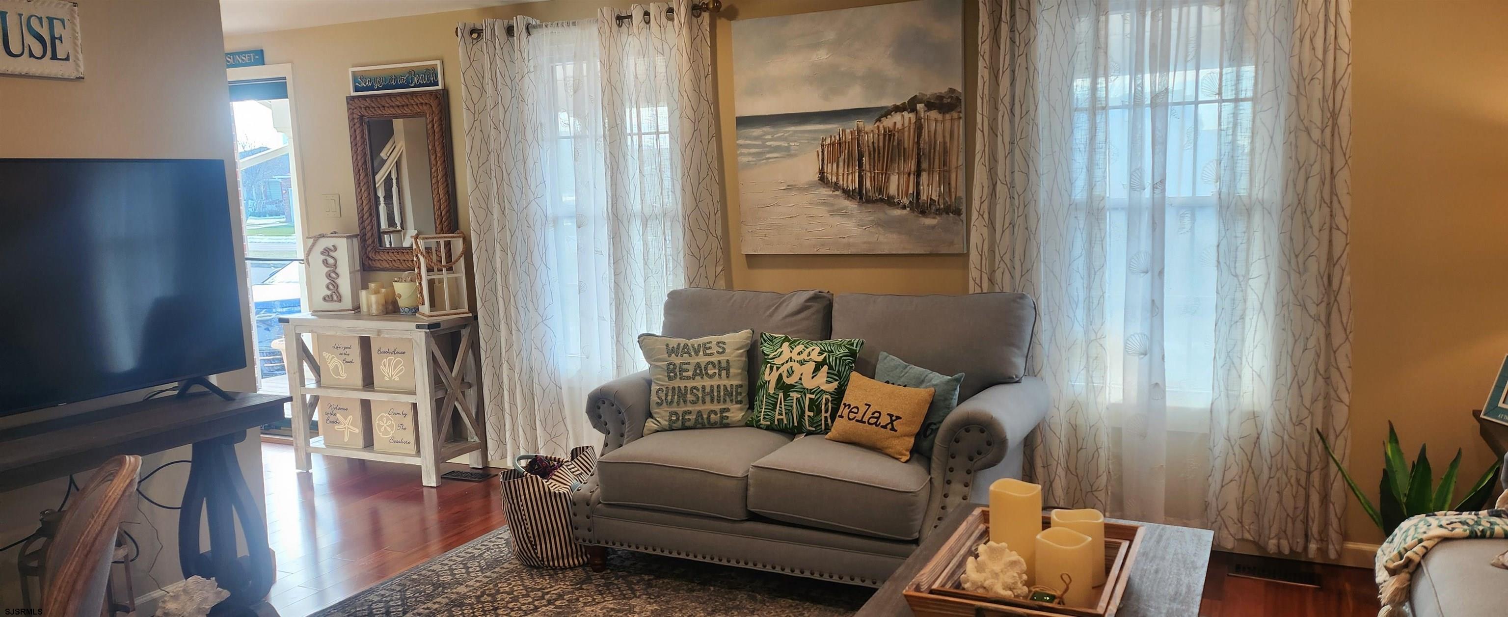 5217 Harbor Beach Boulevard, Unit SEA POINT Brigantine, NJ 08203 - Photo 4 of 38 a living room with furniture and a window