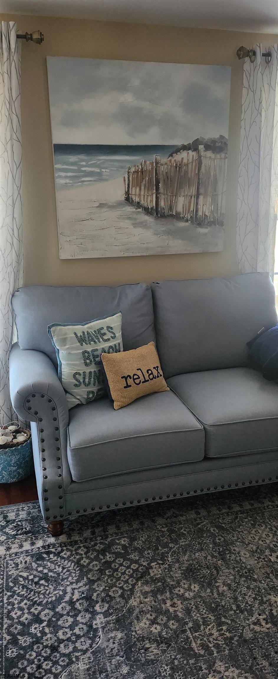 5217 Harbor Beach Boulevard, Unit SEA POINT Brigantine, NJ 08203 - Photo 9 of 38 a living room with furniture