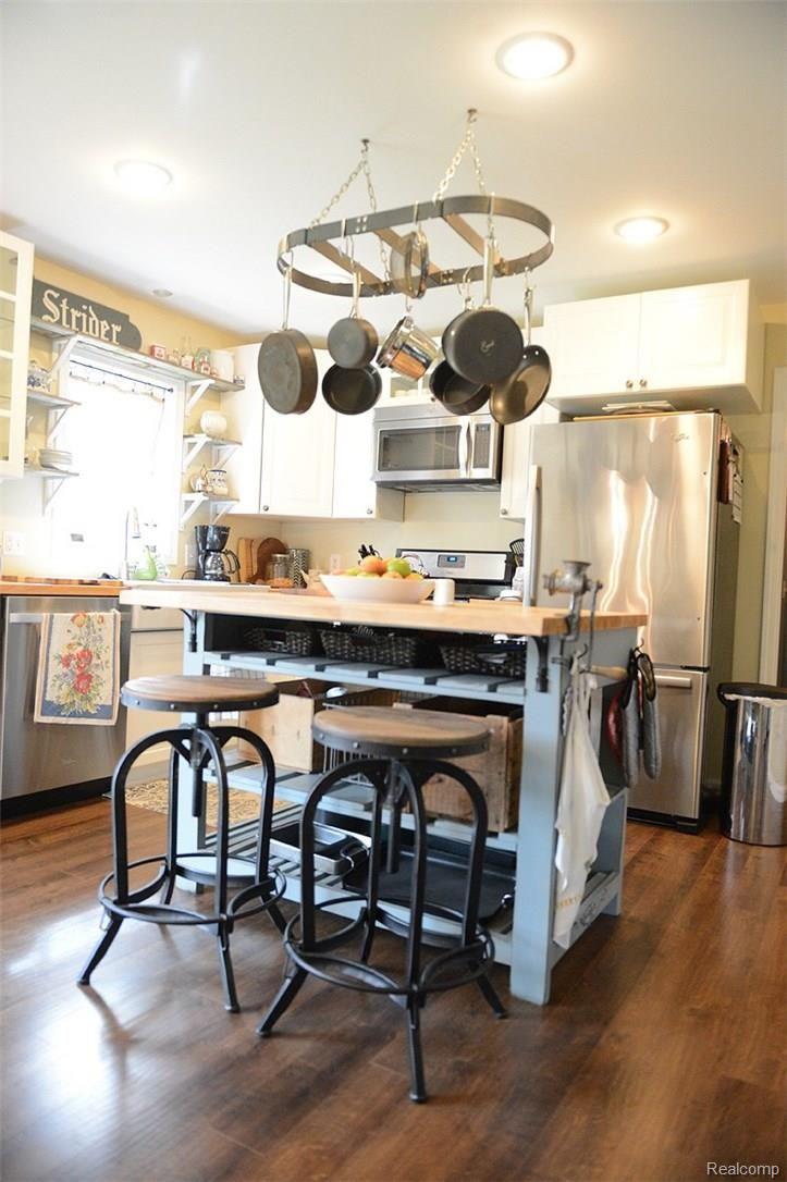 2800 Porter Road White Lake, MI 48383 - Photo 7 of 40 Custom island in kitchen/new stainless appliances too!