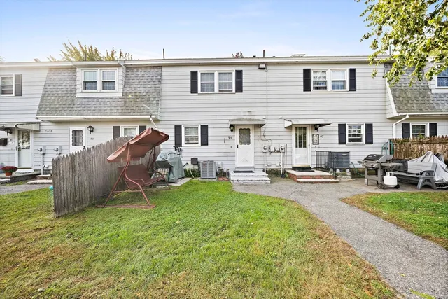 a view of a house with backyard porch and sitting area