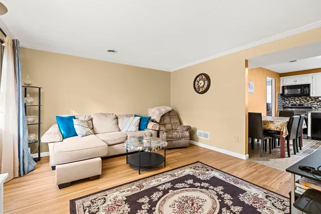 a living room with furniture and a table