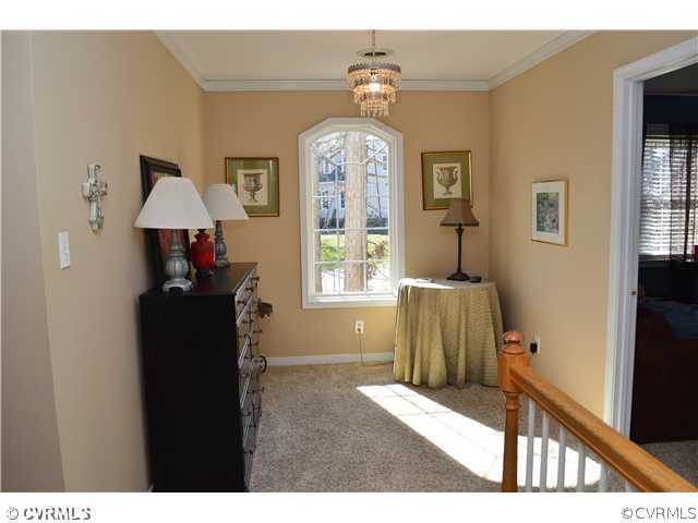 4706 Twin Cedars Road Chester, VA 23831 - Photo 13 of 24 a front view of a house with wooden floor