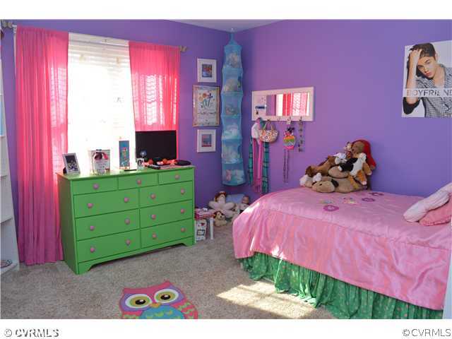4706 Twin Cedars Road Chester, VA 23831 - Photo 16 of 24 a bed room with a bed and a two dressers