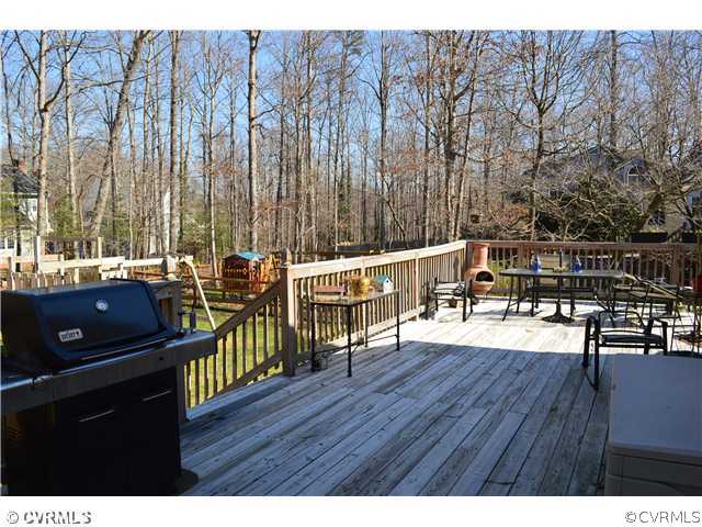 4706 Twin Cedars Road Chester, VA 23831 - Photo 21 of 24 a view of a chairs and table on the wooden floor
