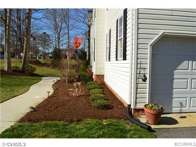 4706 Twin Cedars Road Chester, VA 23831 - Photo 22 of 24 a backyard of a house with barbeque oven