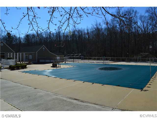 4706 Twin Cedars Road Chester, VA 23831 - Photo 23 of 24 a view of swimming pool with a yard