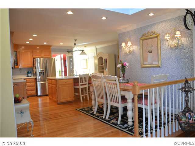 4706 Twin Cedars Road Chester, VA 23831 - Photo 3 of 24 a view of a dining area with furniture and a chandelier