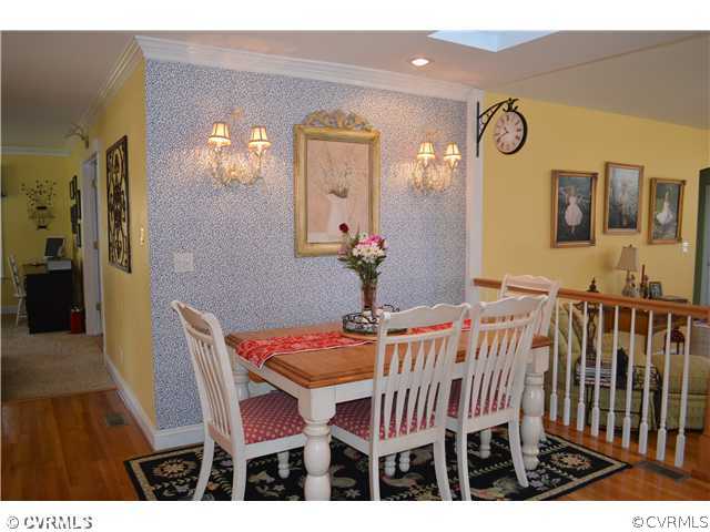 4706 Twin Cedars Road Chester, VA 23831 - Photo 5 of 24 a dining room with furniture and wooden floor
