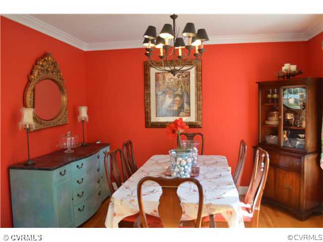 4706 Twin Cedars Road Chester, VA 23831 - Photo 6 of 24 a view of a dining room with furniture and wooden floor