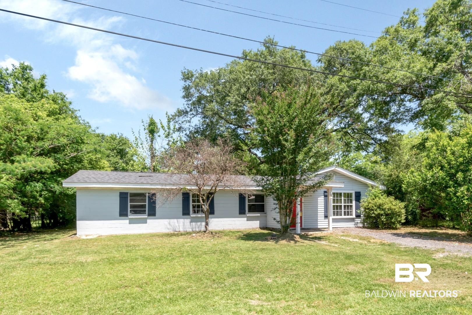 5650 Alice Drive Theodore, AL 36582 - Photo 1 of 15 Ranch-style house with a front yard