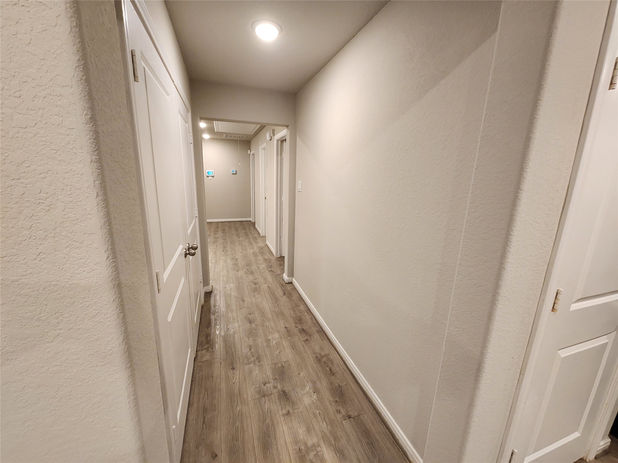 422 3rd Street Rosenberg, TX 77471 - Photo 12 of 14 a view of a hallway with wooden floor and staircase