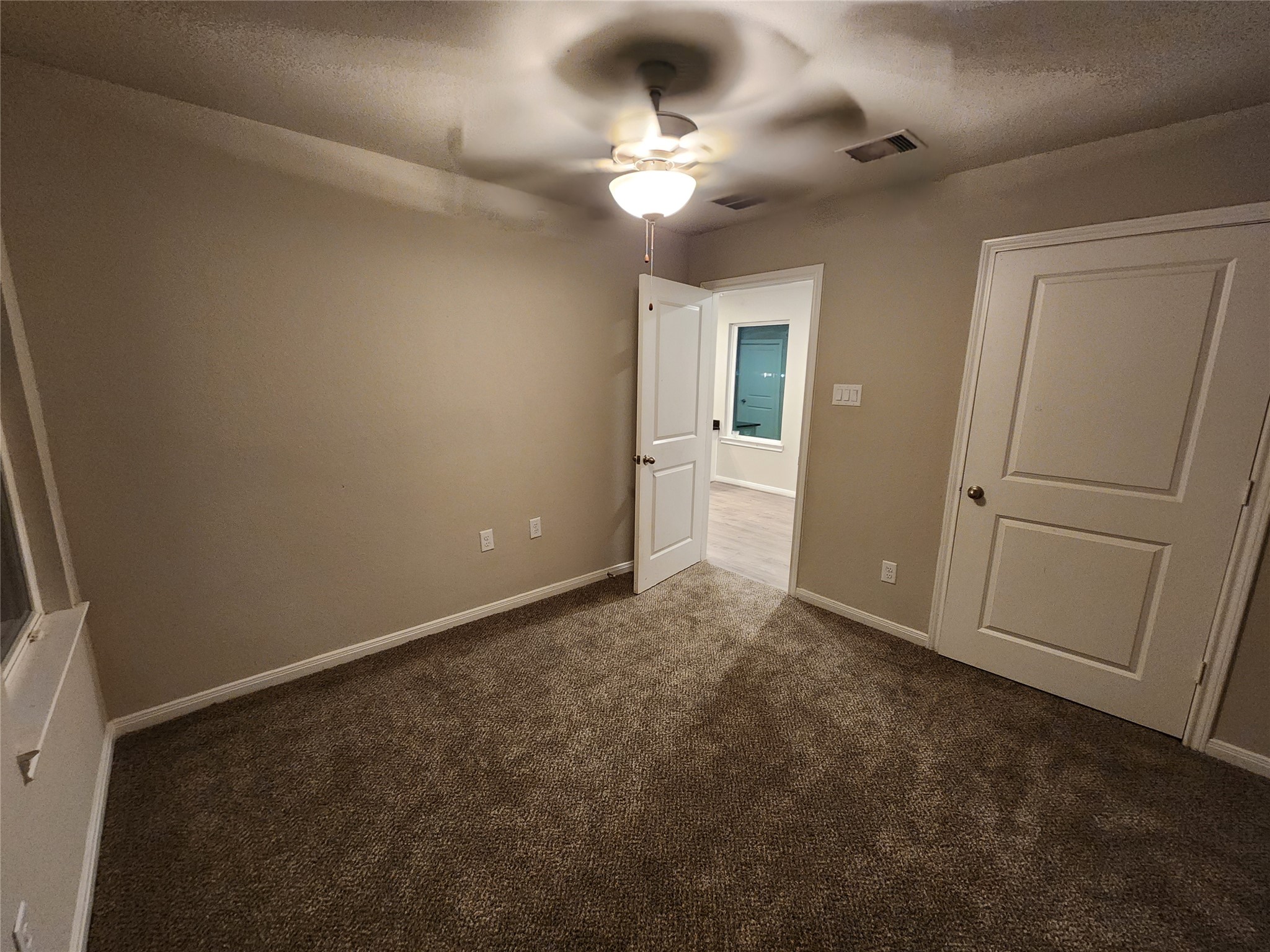 422 3rd Street Rosenberg, TX 77471 - Photo 7 of 14 wooden floor in an empty room