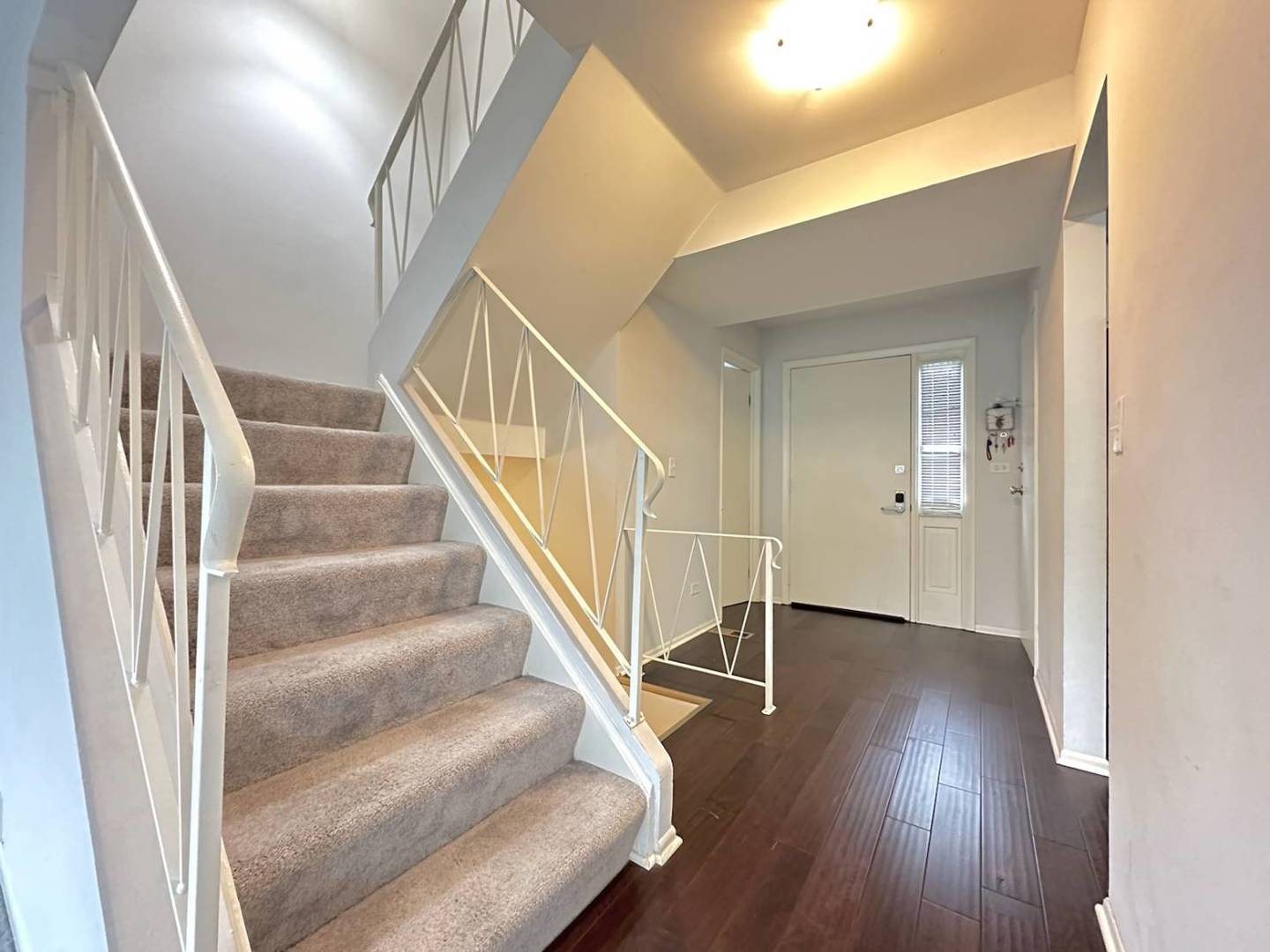 211 Monroe Road Bolingbrook, IL 60440 - Photo 4 of 7 a view of entryway and hall with wooden floor
