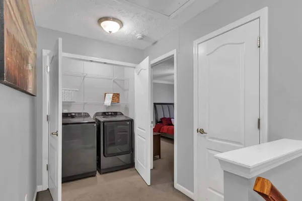a kitchen with a stove and a refrigerator