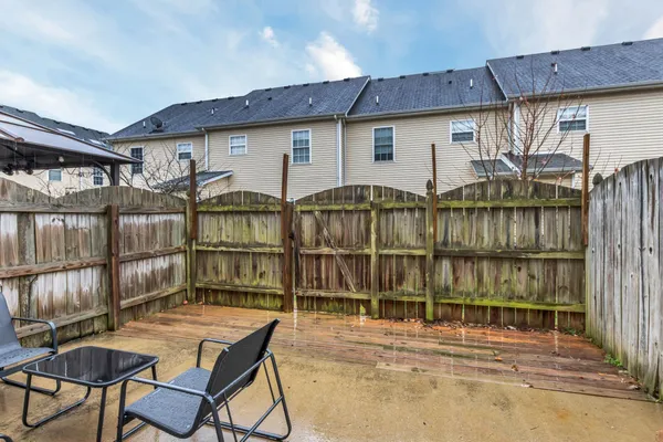 a view of a house with backyard and balcony