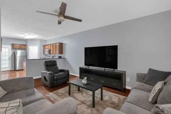 a living room with furniture and a flat screen tv