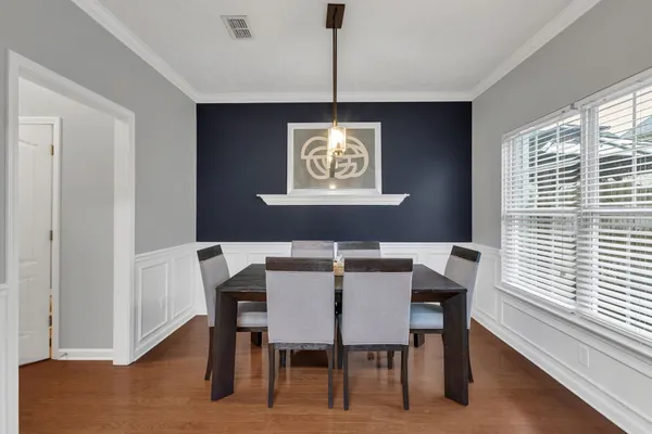 a view of a dining room with furniture window and outside view
