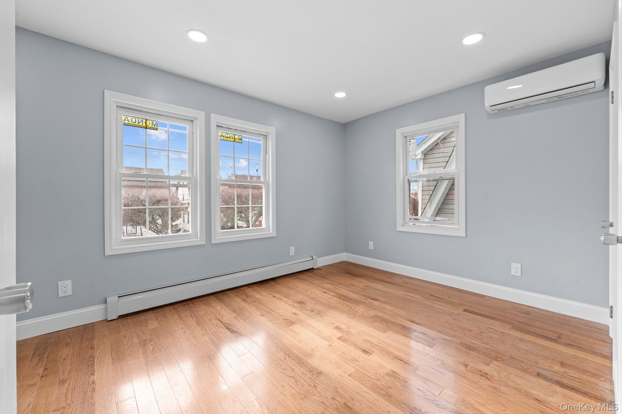 142-35 Sutter Avenue Queens, NY 11436 - Photo 11 of 21 a view of an empty room with wooden floor and a window