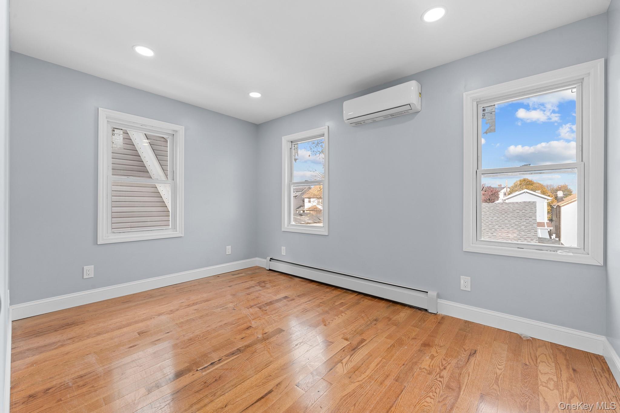 142-35 Sutter Avenue Queens, NY 11436 - Photo 12 of 21 a view of an empty room with wooden floor and a window