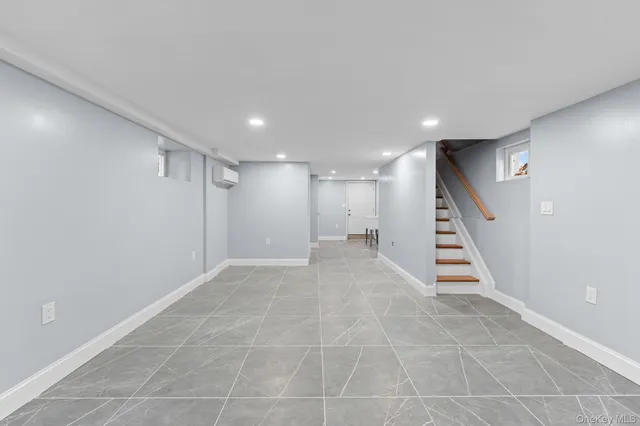 a view of an empty room with stairs