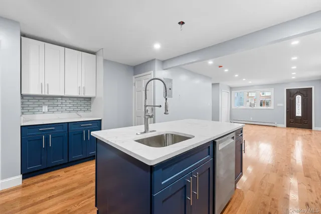 a kitchen with a sink and cabinets