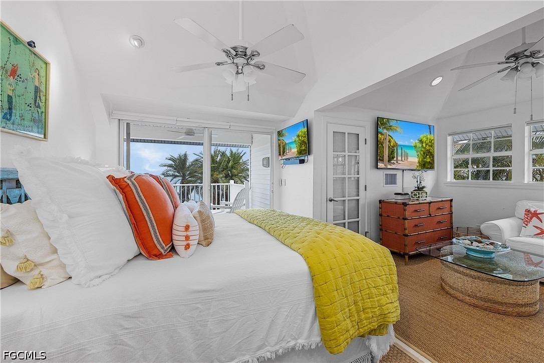 515 Useppa Useppa Island Bokeelia, FL 33922 - Photo 26 of 43 a bedroom with a bed and wooden floor