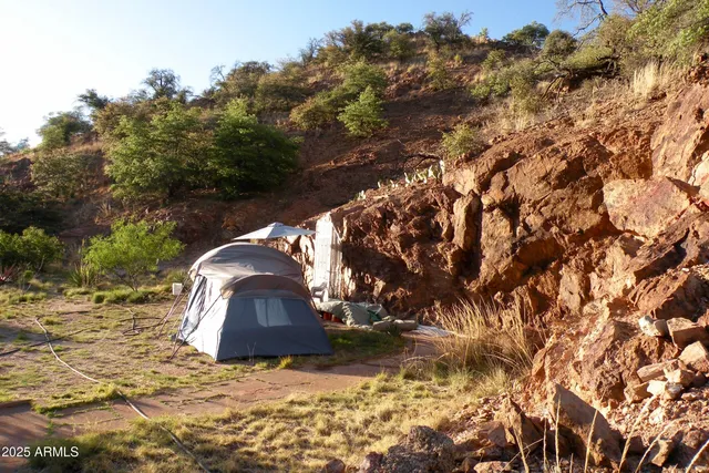 a close view of water heater and wooden cabinets
