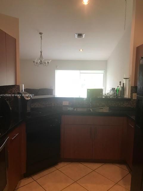 Savanna Weston, FL 33327 - Photo 13 of 21 a view of a kitchen from the hallway